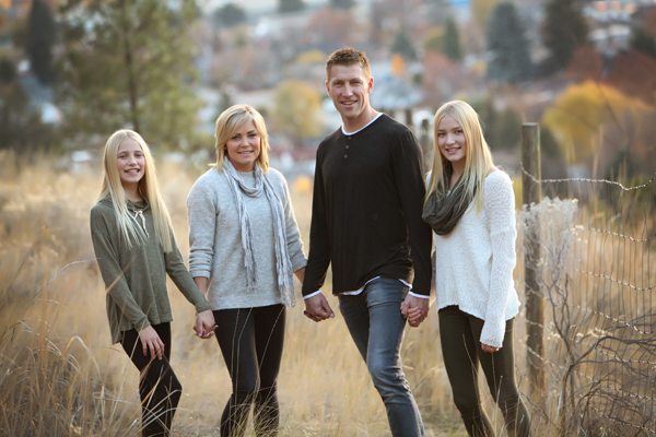 Fall portrait family holding hands